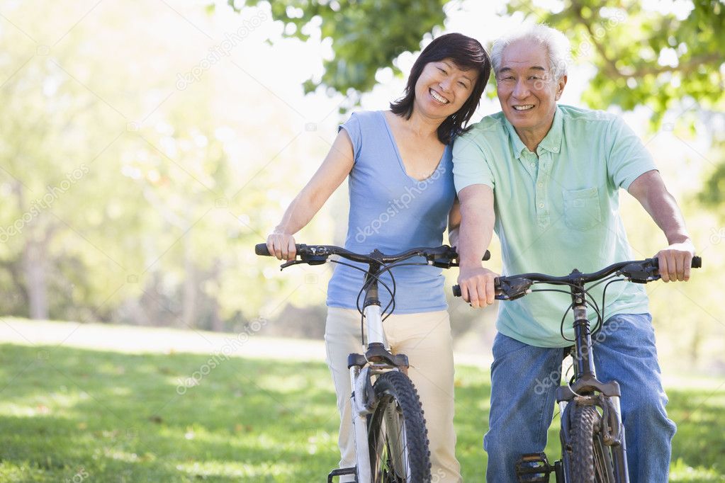 asian-bikes-depositphotos_4764577-stock-photo-mature-couple-bike-riding