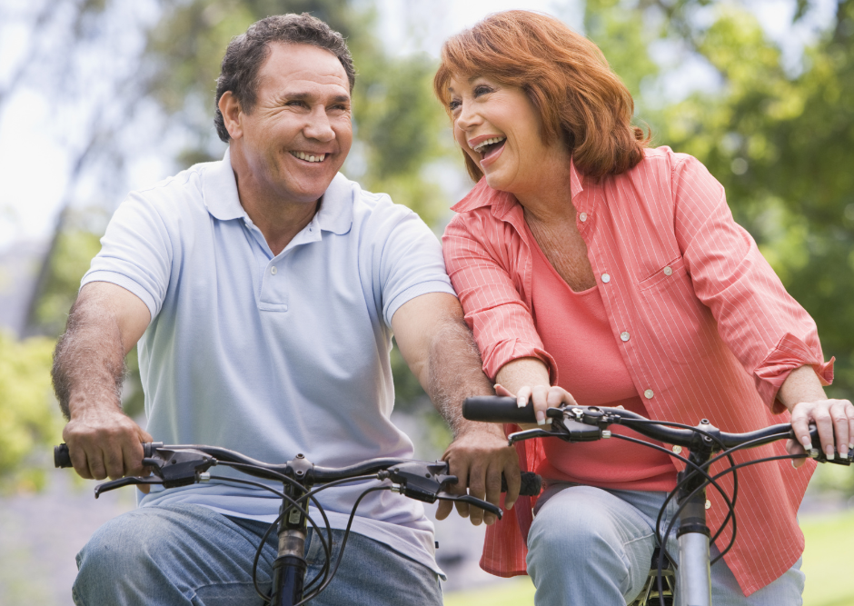 Happy couple riding bikes Happy couple riding bikes
